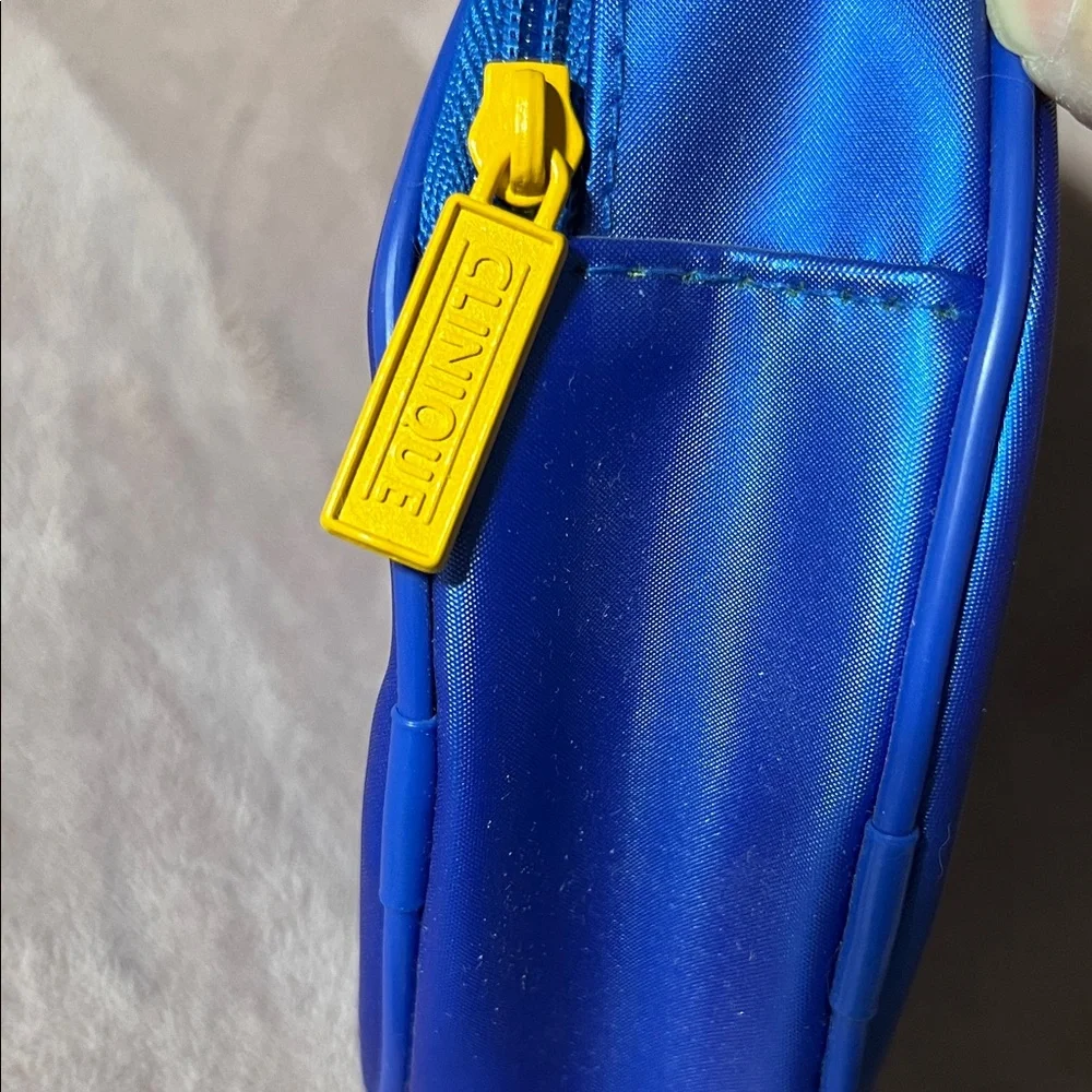 Clinique Blue floral cosmetics bag with Yellow Zipper